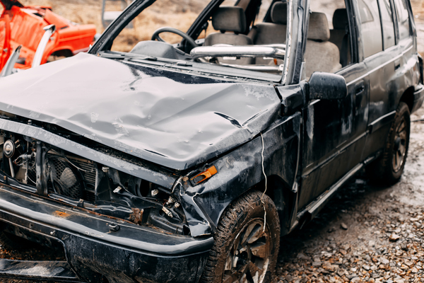 Damaged SUV requiring inspection of restored car, showing chassis damage and need for structural repair to certify the restored title